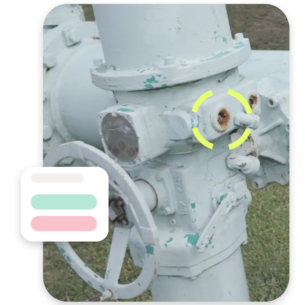 Inspector review of highlighted corrosion on industrial valve with visual status indicators